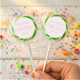 Personalized lollipop pair with green candy swirl, 'Custom Design' label on each stick