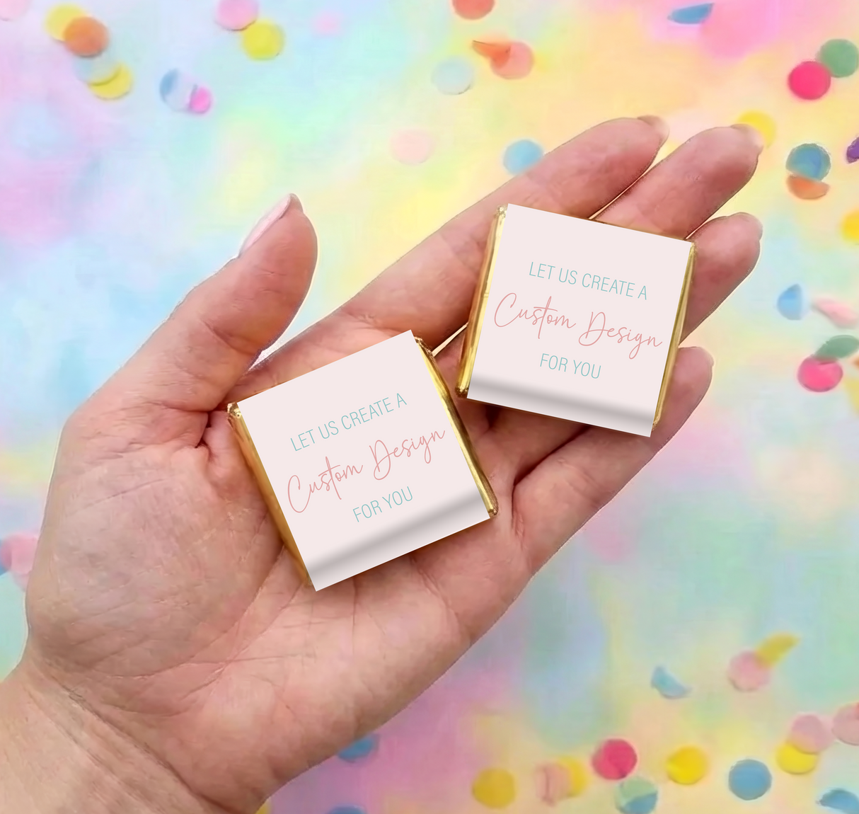 Mini custom design chocolate square with white label and gold foil frame, held in hand
