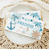 Nautical chocolate bar wrapper with dolphins, anchor, ship wheel, and “Freddie turns 3”.