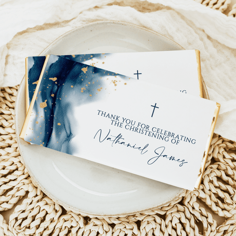 Navy watercolor chocolate bars with gold flecks, thank-you card with cross