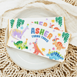 Birthday chocolate bar wrapper with dinosaurs and text “Asher turns three”
