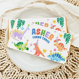 Birthday chocolate bar wrapper with dinosaurs and text “Asher turns three”