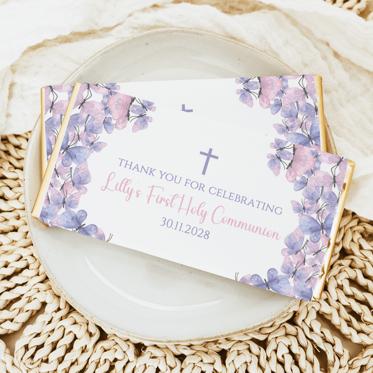 Chocolate bar wrapper with pastel purple butterfly florals, crosses, thank-you communion text