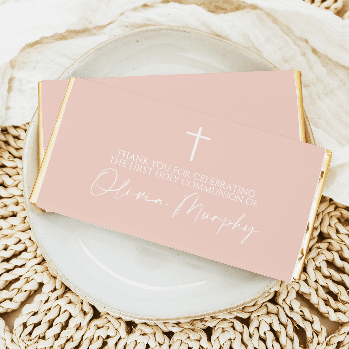 First Holy Communion chocolate bars with pink wrapper, white cross and celebratory text