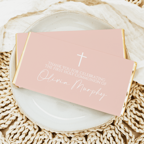 First Holy Communion chocolate bars with pink wrapper, white cross and celebratory text