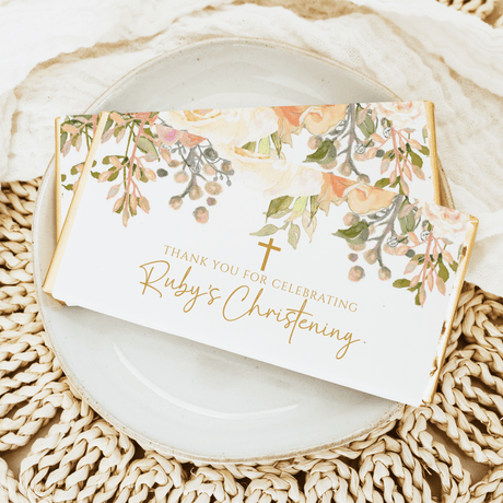 Christening chocolate bars with watercolor florals, cross, and 'Ruby's Christening' text