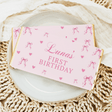 Pink chocolate bar wrapper: Luna's First Birthday with bows and hearts