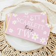Pink daisy birthday chocolate bar wrapper with '1st' and 'Sweet' lettering