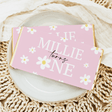 Pink floral chocolate bar wrapper with white flowers and cursive text