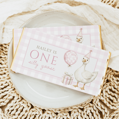 Pink plaid first birthday chocolate bar wrapper with goose illustrations and party hat