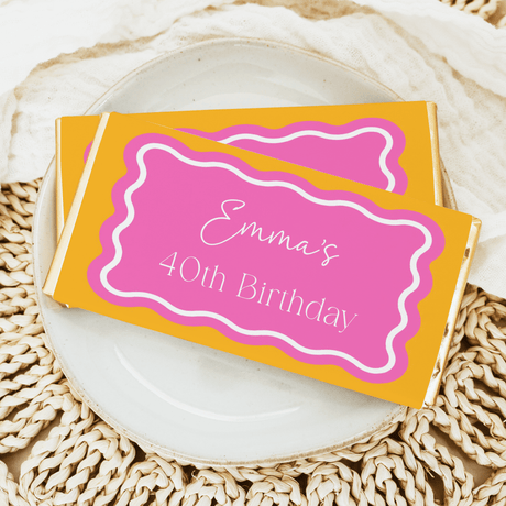 Pink and orange wavy chocolate bar wrapper with “Emma’s 40th Birthday” text