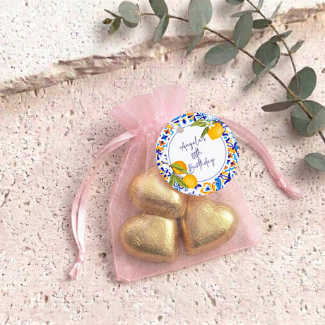 Gold heart chocolates in sheer pink organza drawstring bag, with birthday label