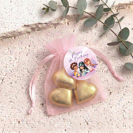 Personalised organza gift bag with heart chocolates, pink fabric and gold hearts drawstring
