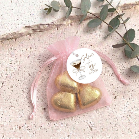 Organza gift bag with metallic gold heart chocolates and sheer pink pouch