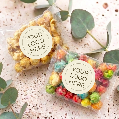 Personalised popcorn bags: two clear bags, one with yellow popcorn, one with rainbow mix