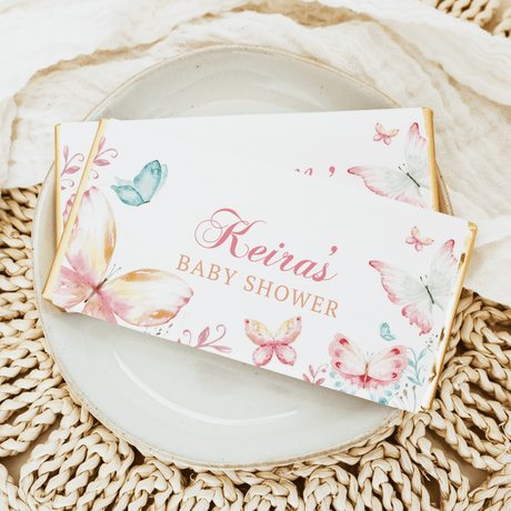 Personalised baby shower chocolate bars with butterfly design and “Hevias” text