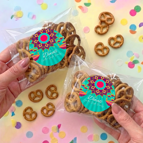 Personalised Diwali pretzel bag with clear wrap, brown pretzels, and teal circular label