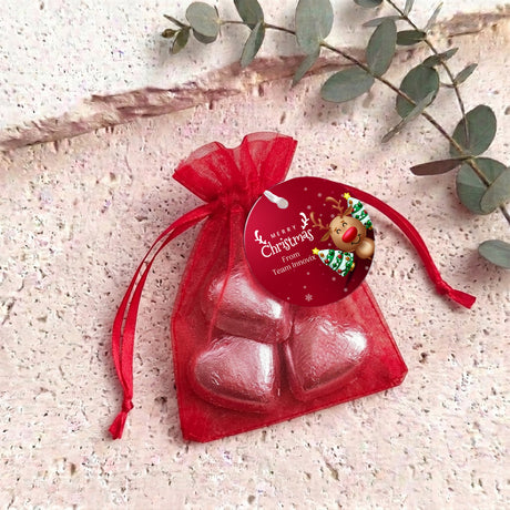 Personalised organza gift bag with red heart chocolates and red drawstring