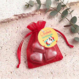 Red metallic heart chocolates in red organza gift bag with drawstring