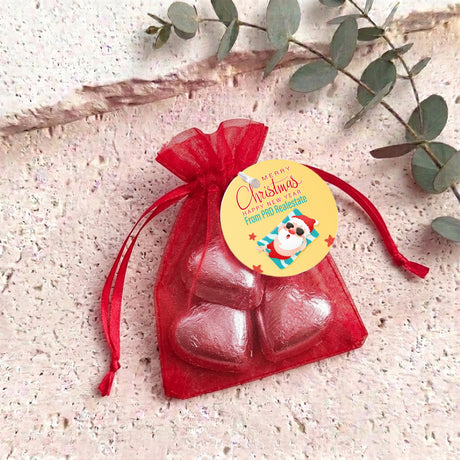 Red metallic heart chocolates in red organza gift bag with drawstring
