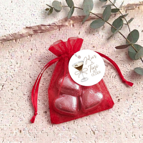 Organza gift bag with metallic red heart chocolates and sheer red pouch