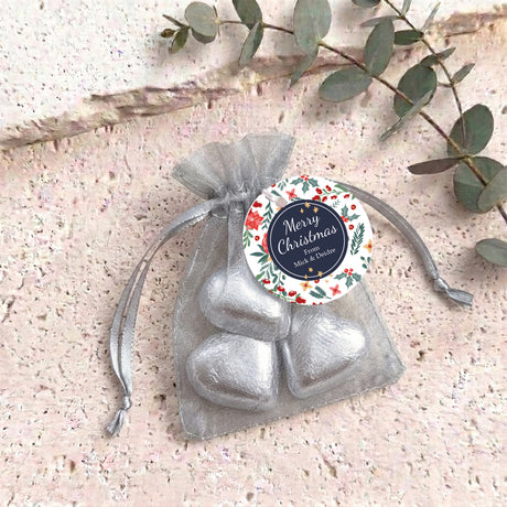 Organza gift bag with silver foil heart chocolates and round Christmas label
