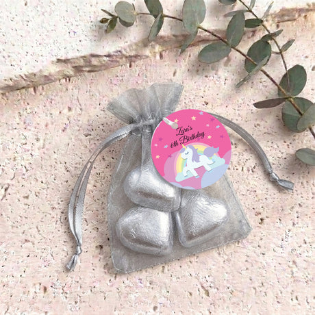 Silver heart chocolates in a gray-silver organza gift bag with birthday tag