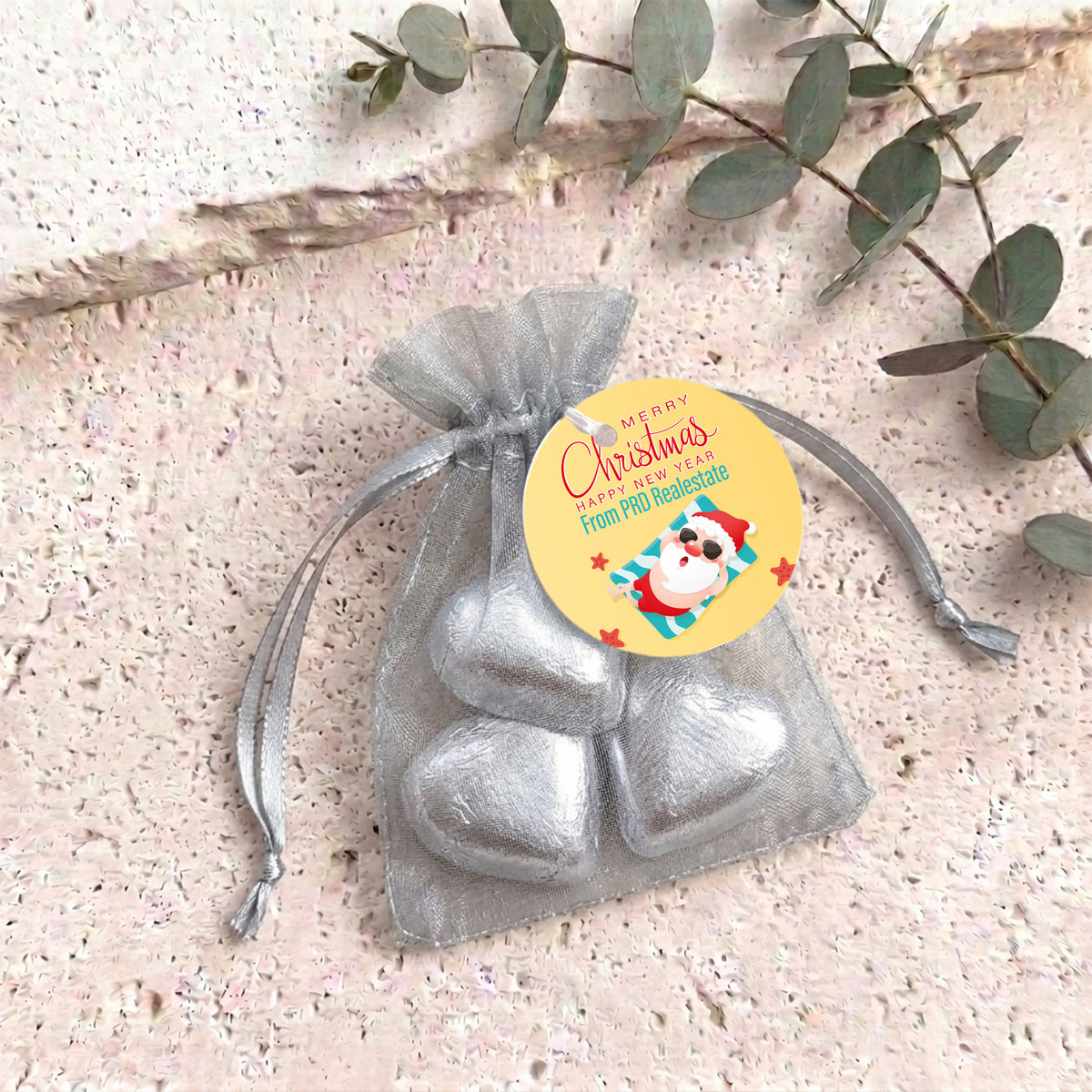 Silver metallic heart chocolates in sheer white organza gift bag with drawstring
