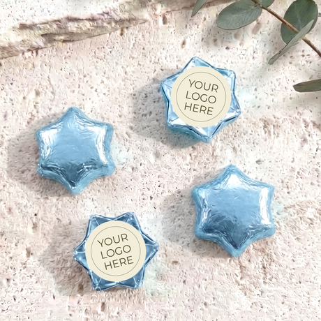 Foil-covered chocolate stars with logo label, blue foil star chocolates