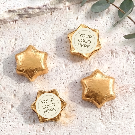Foil-covered chocolate stars with logo label, gold foil star chocolates