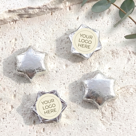 Foil-covered chocolate stars with logo label, silver foil star chocolates