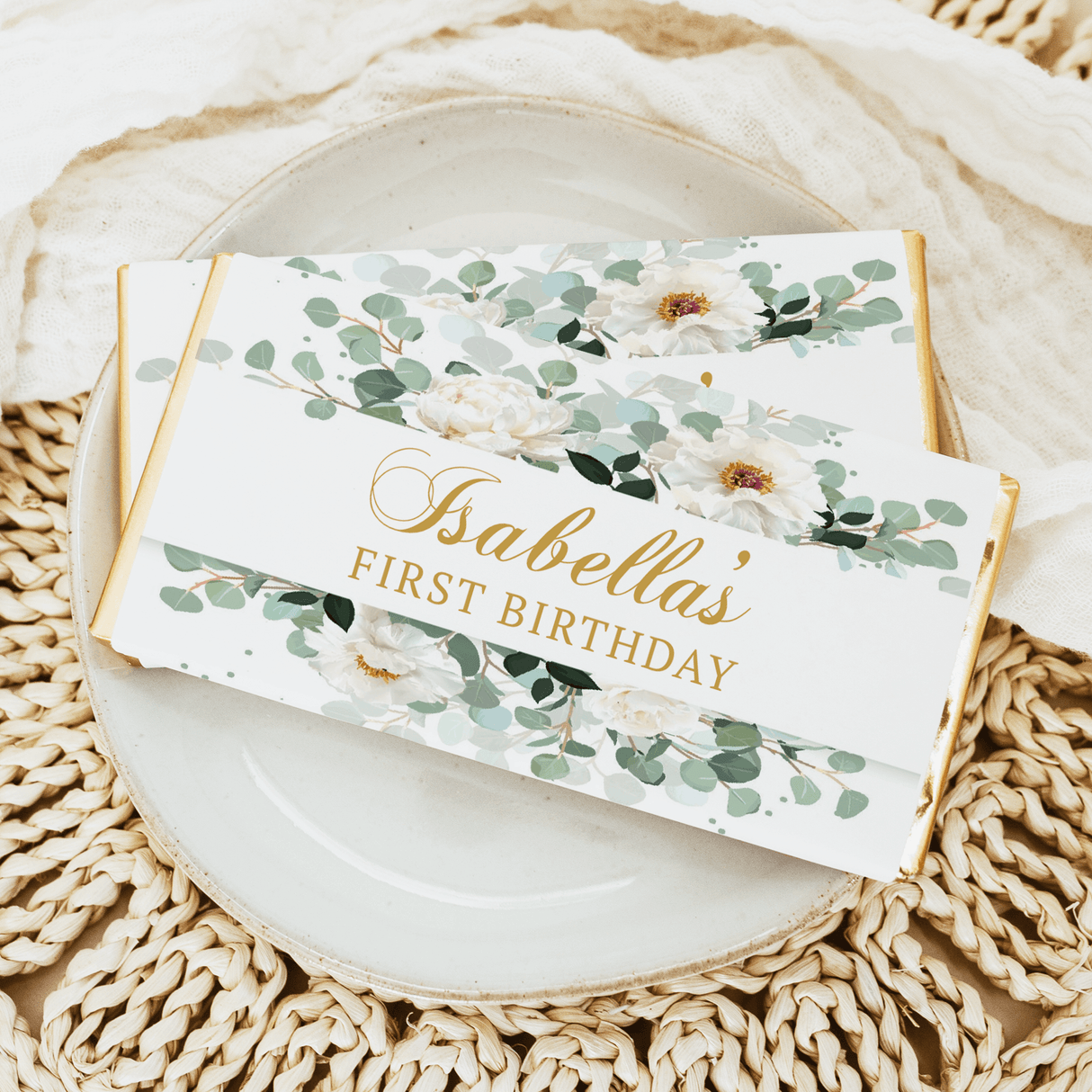 Sabella's First Birthday chocolate bar with white florals and green foliage label