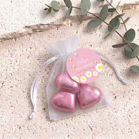 Personalised organza birthday bag with pink heart-shaped chocolates and pink gift tag
