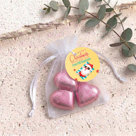 Pink metallic heart chocolates in sheer white organza gift bag with drawstring