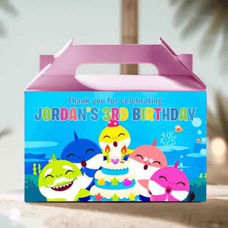 Pink gable favor box with colorful Baby Shark birthday scene and candles illustration