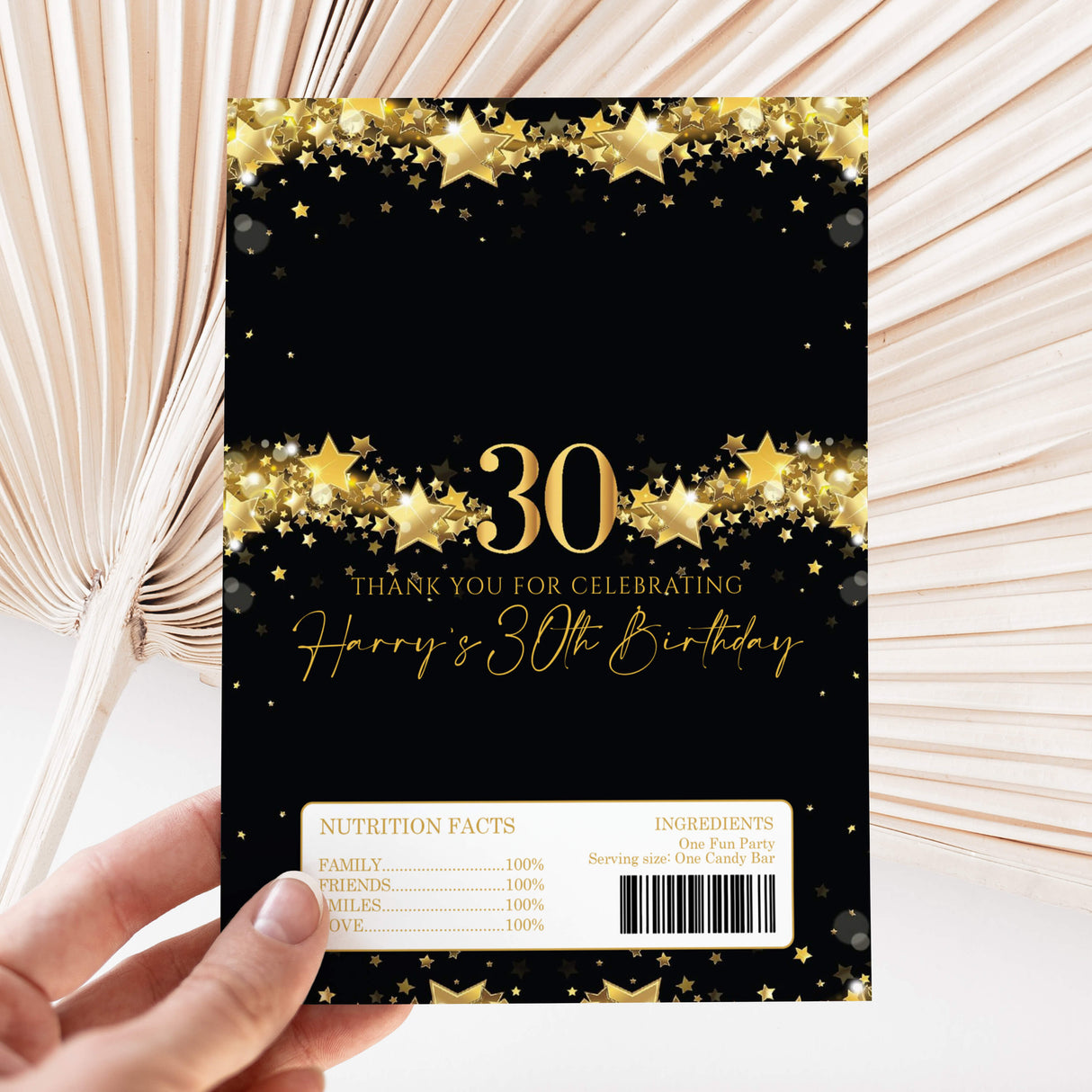 Chocolate wrapper sheet with black and gold star design, 30, and nutrition label panel