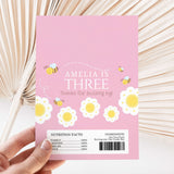 Pink DIY printed chocolate wrapper with 'Amelia is Three' text, bees, and flowers
