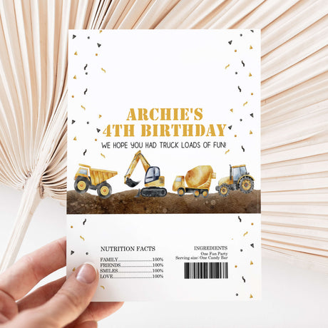 Birthday chocolate wrapper with construction trucks and “ARCHIE’S 4TH BIRTHDAY” text