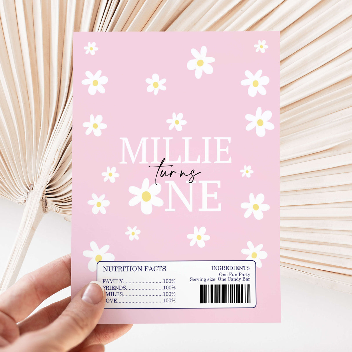 Pink DIY chocolate wrapper sheet with daisies and “Millie Turns One” text