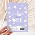 Purple DIY chocolate wrapper with daisies, 'Audrey turns one' text and barcode