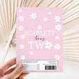 Pink daisy DIY chocolate wrapper sheet with 'Scarlett turns two' text and nutrition/ingredients box.