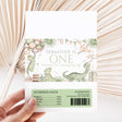 Dinosaur-themed chocolate wrapper with 'ONE' print and nutrition facts panel
