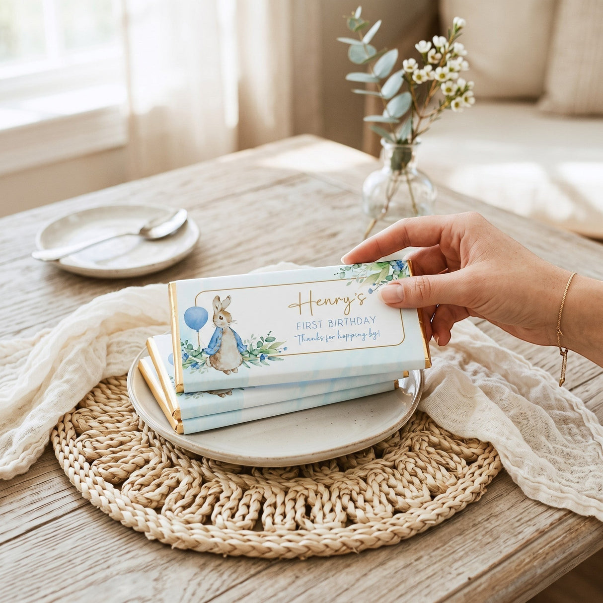 Favour Perfect personalised blue Peter Rabbit first birthday chocolate bar on a plate with gold foil detail.