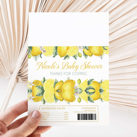 Lemon-themed baby shower chocolate wrapper with yellow fruit print and Nicole’s Baby Shower text