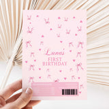 Pink first birthday chocolate wrapper sheet with bow-and-heart pattern and Luna's text