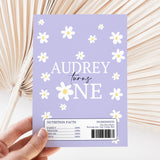 Purple chocolate bar wrapper with white daisies and 'AUDREY turns FIVE' text