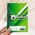 Green soccer-themed chocolate wrapper, Hudson’s 8th birthday text and logo