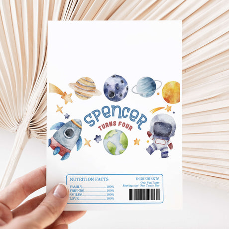 Space astronaut themed chocolate wrapper sheet with planets, rocket, and Spencer