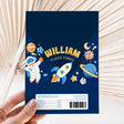 Space-themed chocolate wrapper with William name, “turns three,” and barcode label