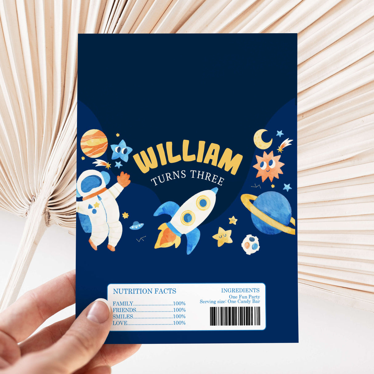 Space-themed chocolate wrapper with William name, “turns three,” and barcode label